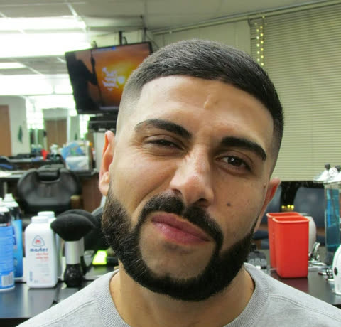 A client after a cut and beard trim