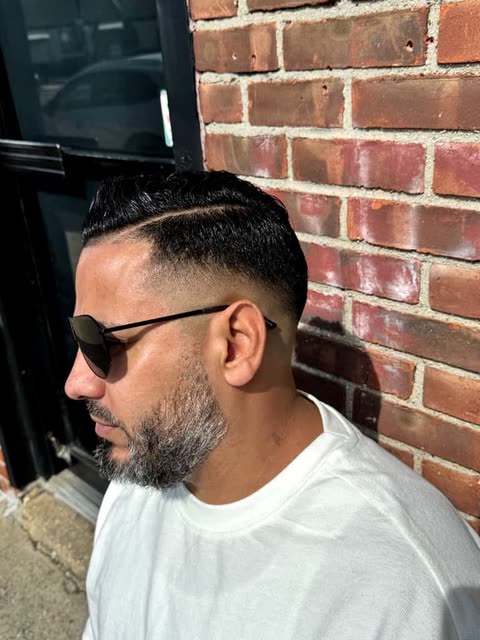 A fade photographed against the brick outside the shop
