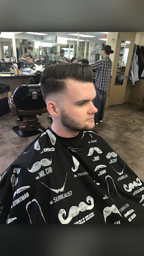 A client in the chair with a fresh cut
