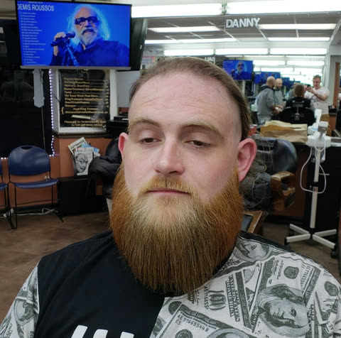 A full beard sculpted to the jaw
