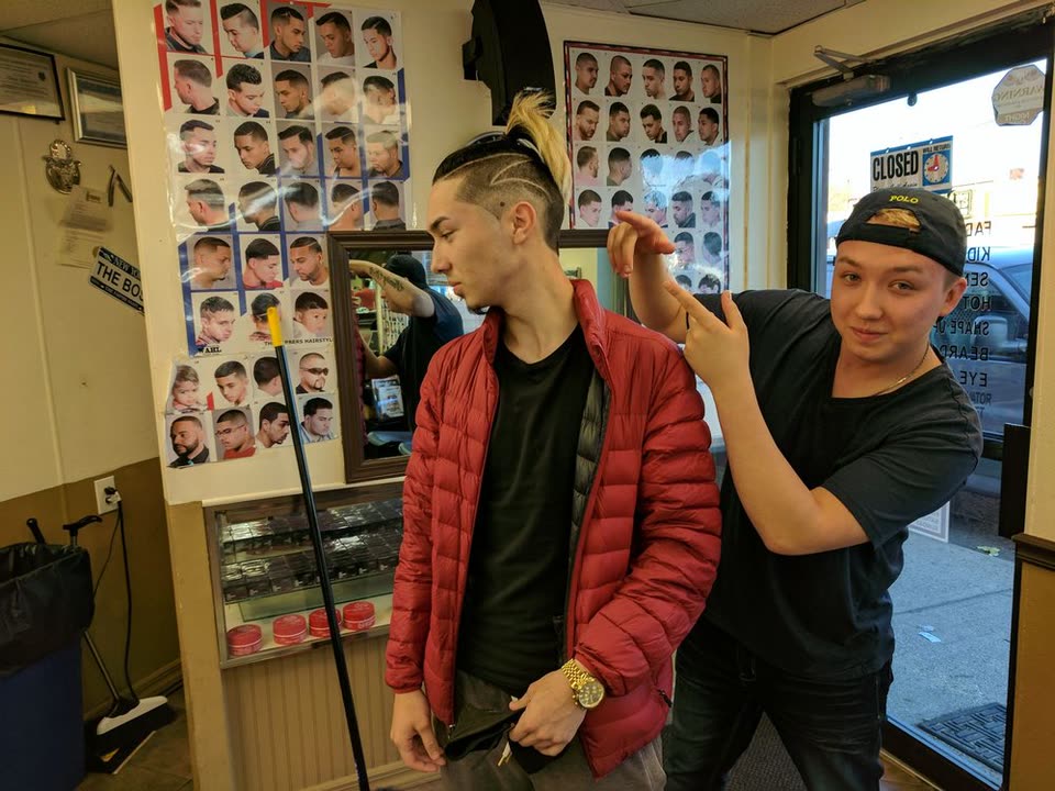 Gali Khik cutting a client's hair at his chair