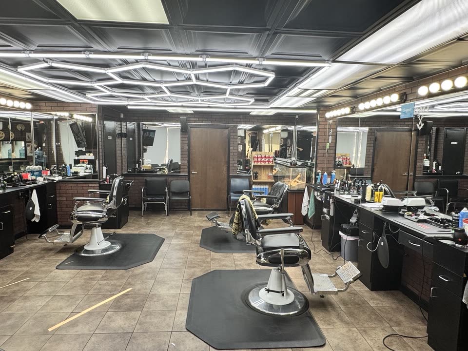 The shop interior, hexagon ceiling lights and tools laid out at the stations