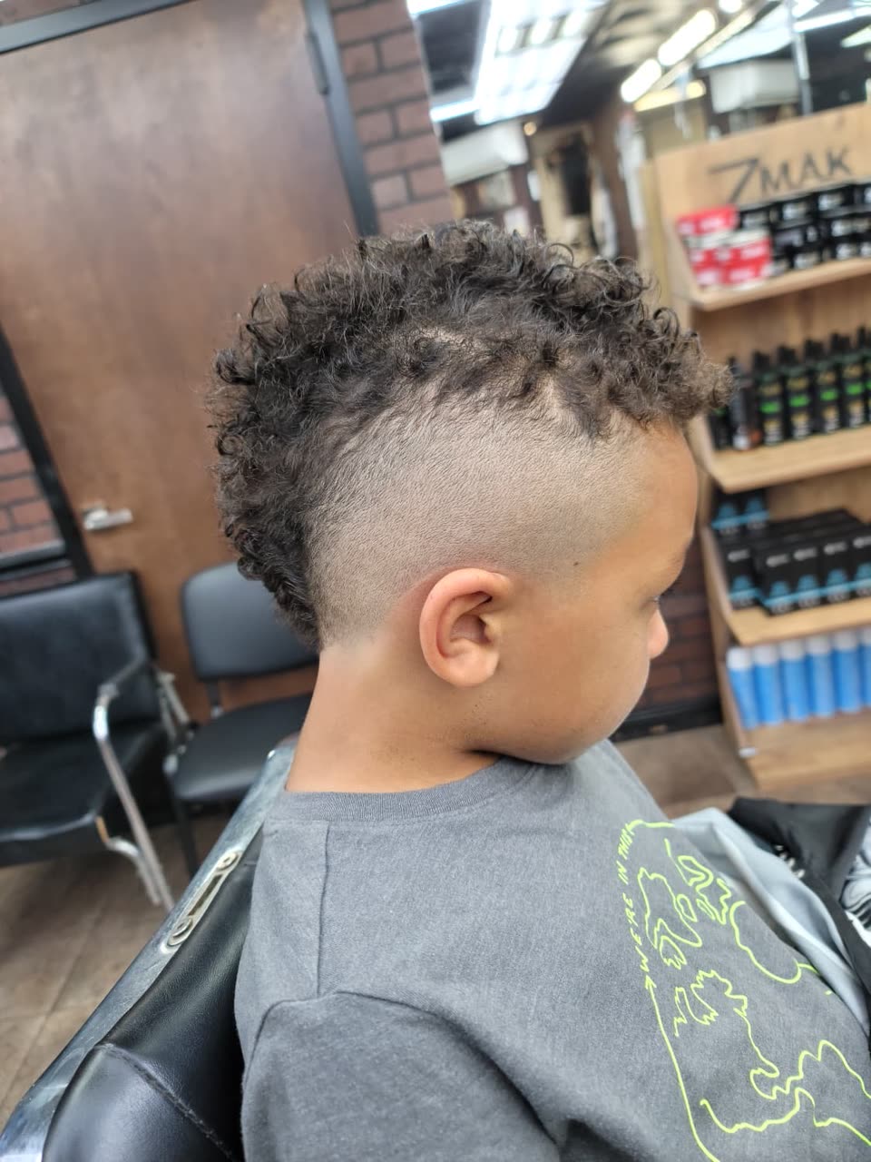 A child's burst fade with curls on top, second angle