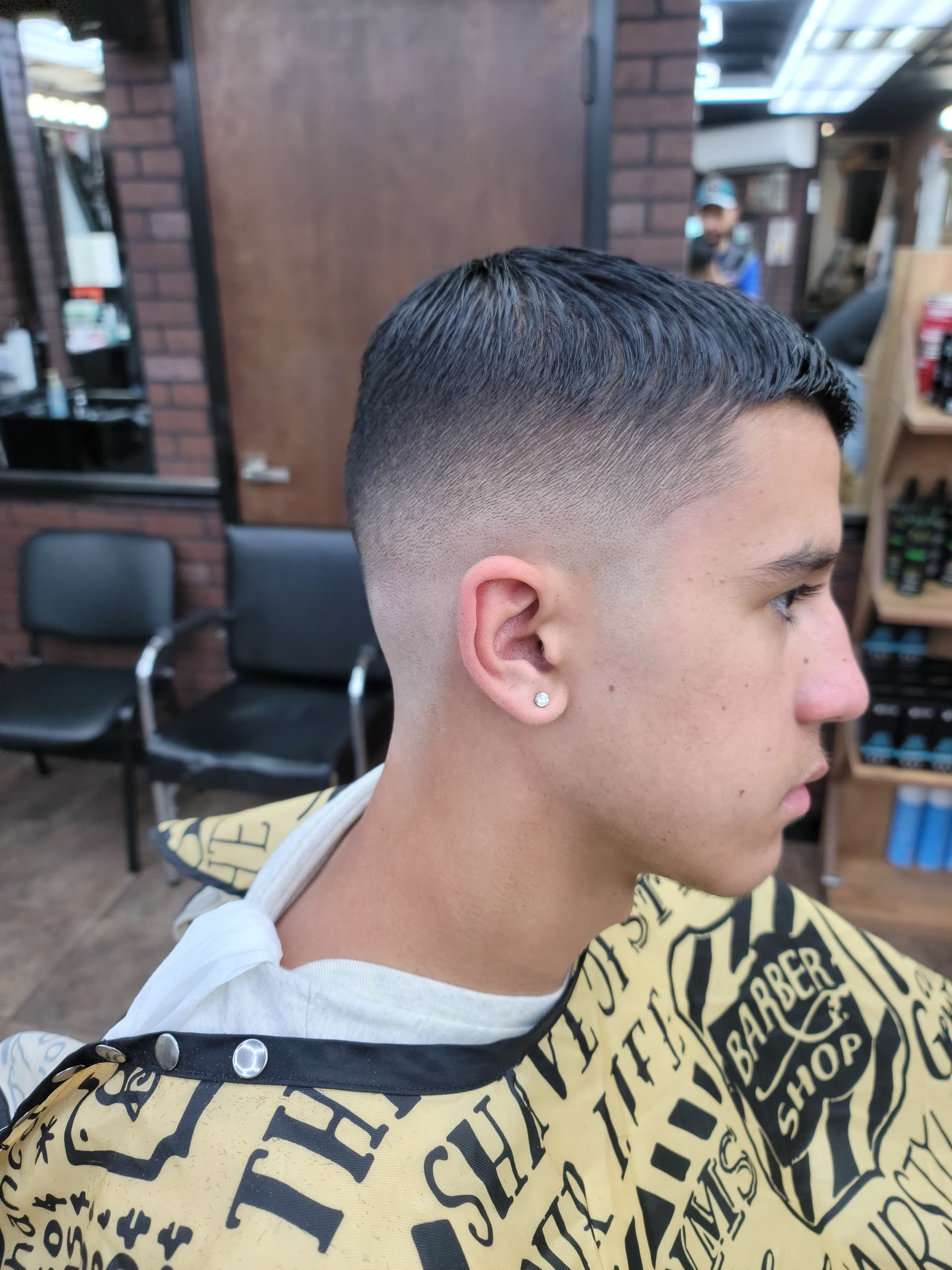 A mid fade, side view, the line sitting level with the temple