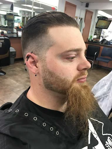 A pompadour worn with a long beard