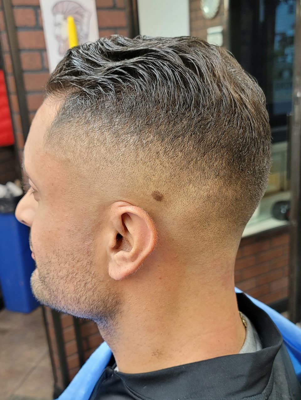Close up of a skin fade, the blend running down to the skin