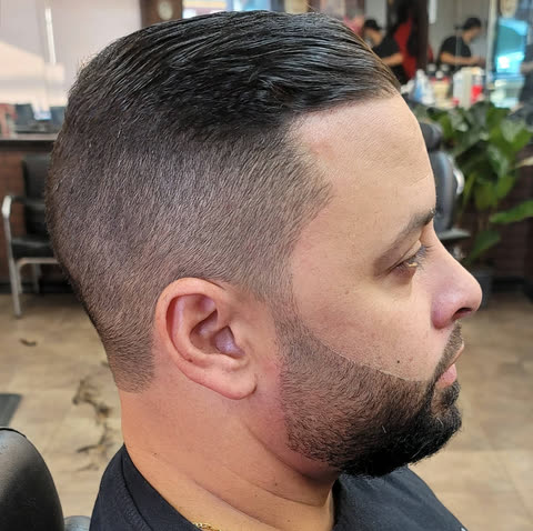 A taper with a tightly shaped beard